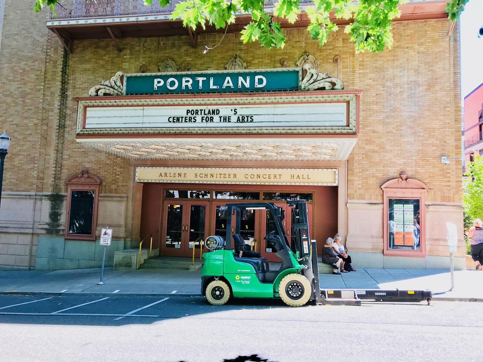 Forklift under a marquee ready to perform